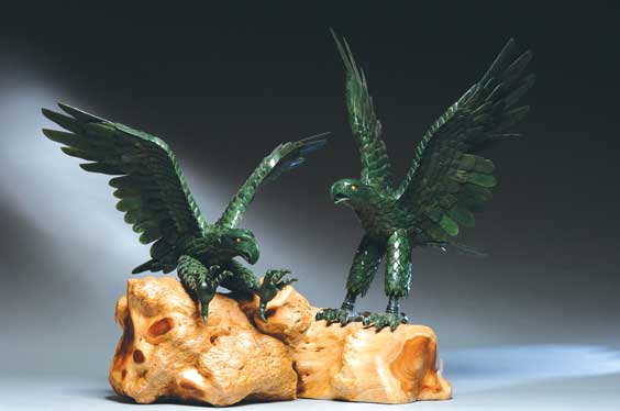 Appraisal: PAIR LARGE SPINACH JADE EAGLES Pair of realistically rendered and