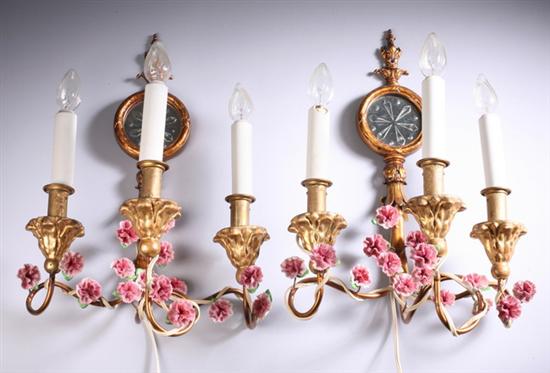 Appraisal: PAIR CONTINENTAL THREE-LIGHT SCONCES th century Gilt-metal backplate with mirror