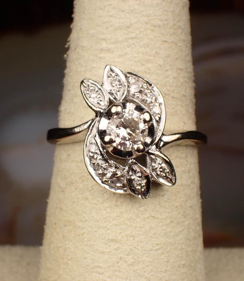 Appraisal: ESTATE DIAMOND AND FOURTEEN KARAT WHITE GOLD RING with ten