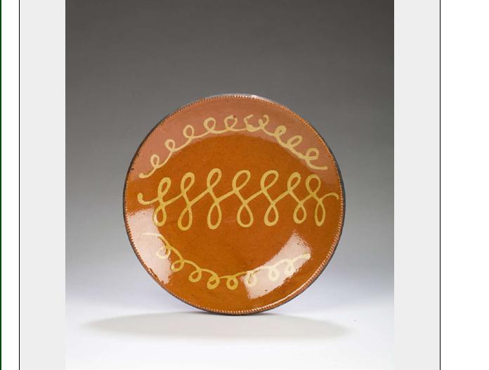 Appraisal: SLIP-DECORATED GLAZED REDWARE DISH Decorated with three rows of trailed