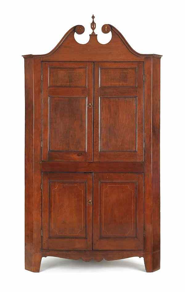 Appraisal: Southern cherry one-piece corner cupboard ca with a broken arch