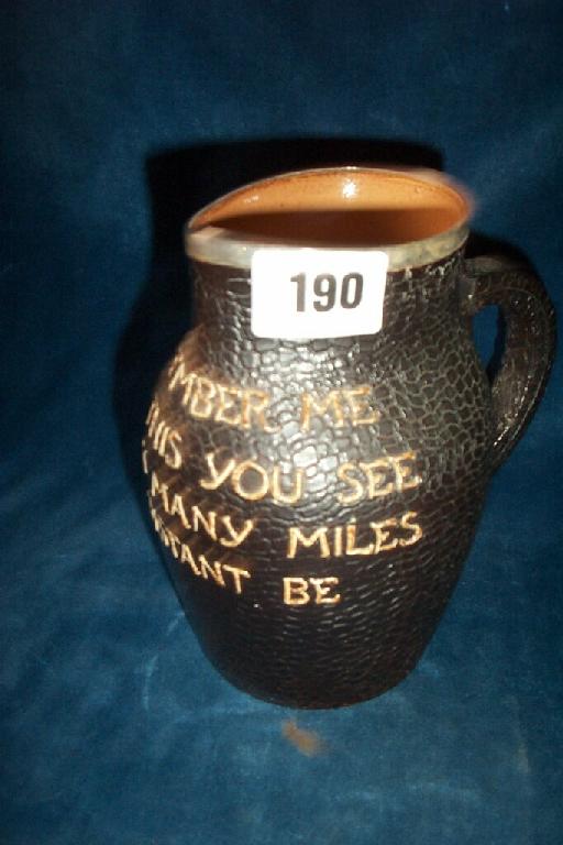 Appraisal: A Doulton Lambeth leather jack jug with all over simulated