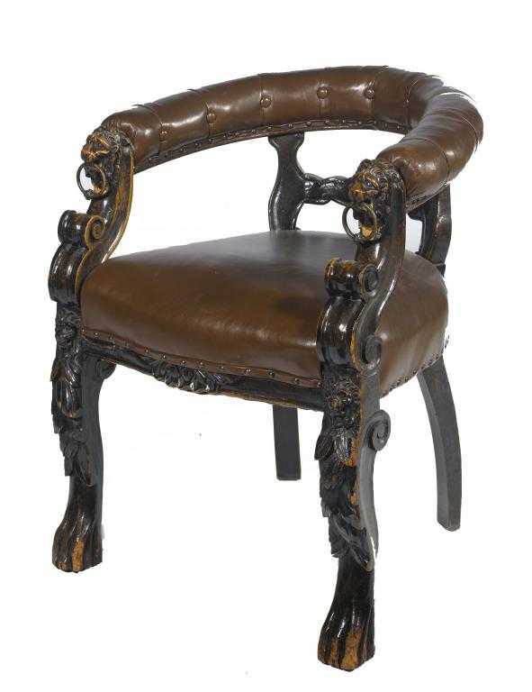 Appraisal: A VICTORIAN CARVED AND EBONISED OAK READING CHAIR the padded