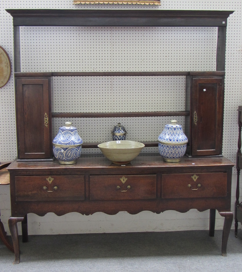 Appraisal: A mid th century oak dresser the open three tier