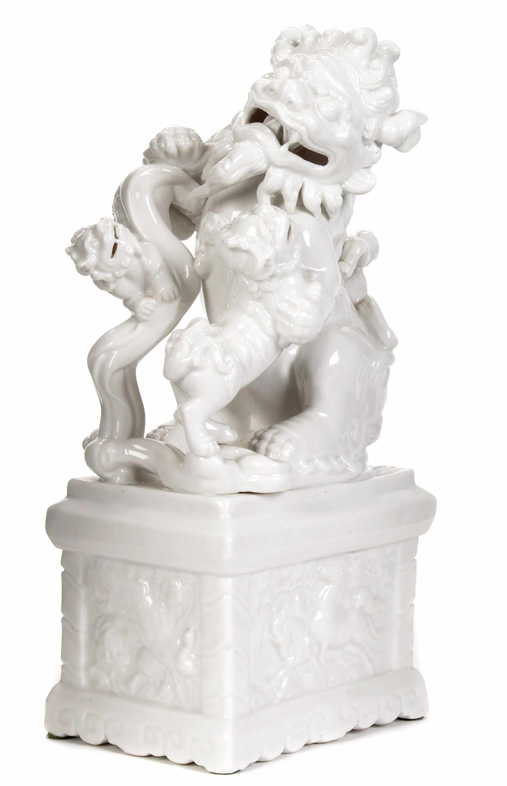 Appraisal: Chinese blanc de chine Fo lion and pup on a