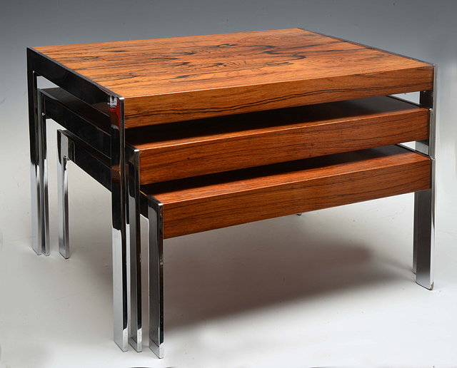 Appraisal: Merrow AssociatesA nest of three rosewood and chrome tables probably