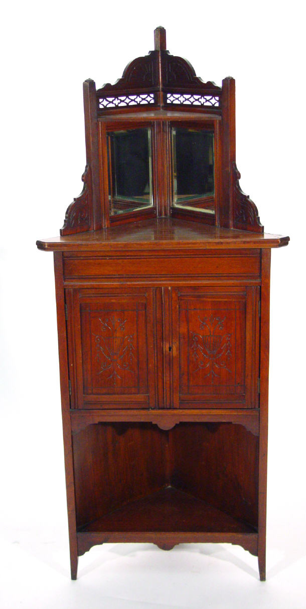 Appraisal: Aesthetic mahogany corner cabinet with pierced fretwork and bevel mirrored