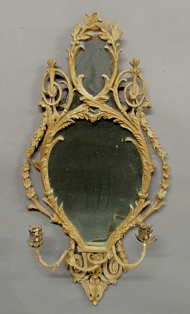 Appraisal: - Continental mirror with an ornately carved frame c and