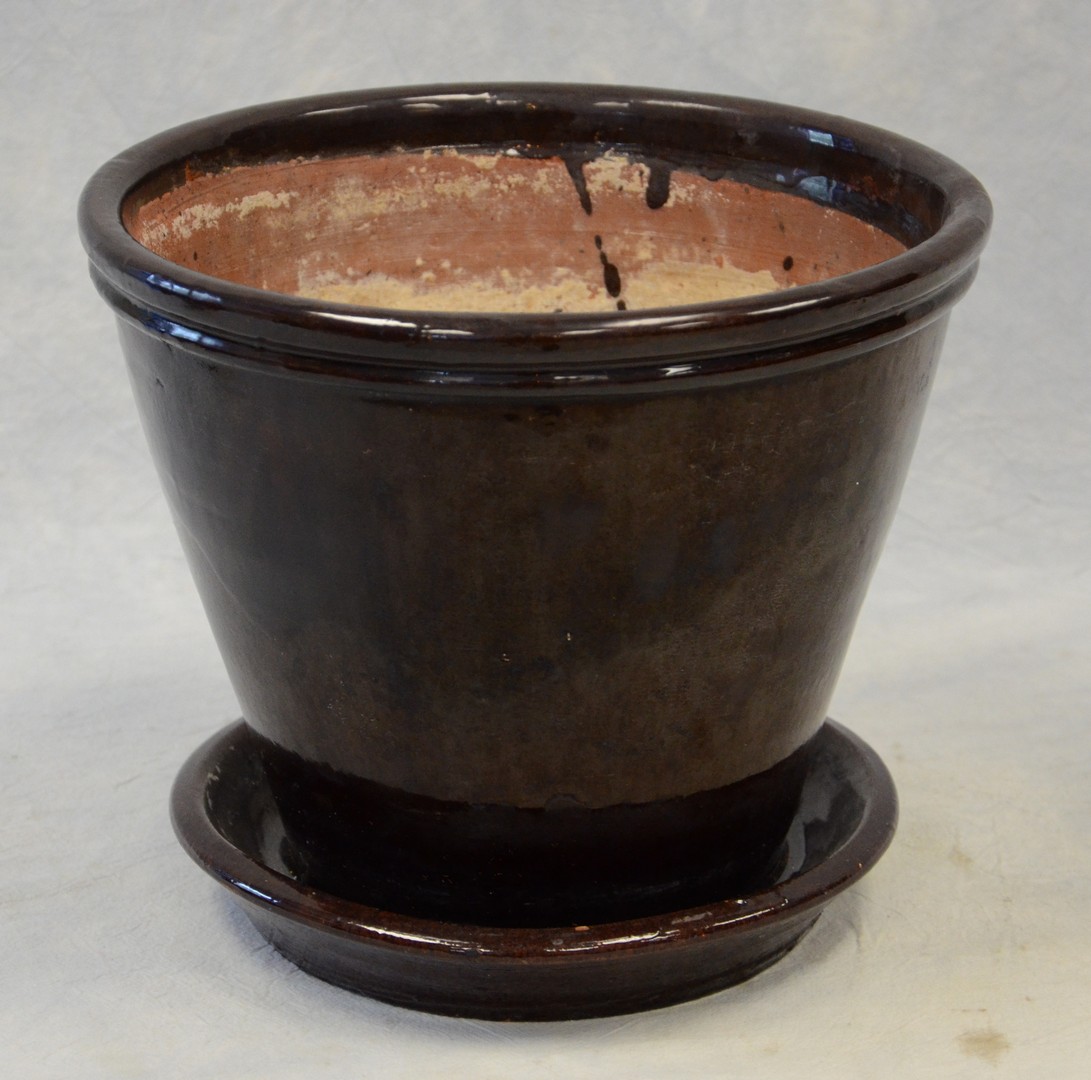 Appraisal: Black redware flower pot with attached saucer Pennsylvania origin c