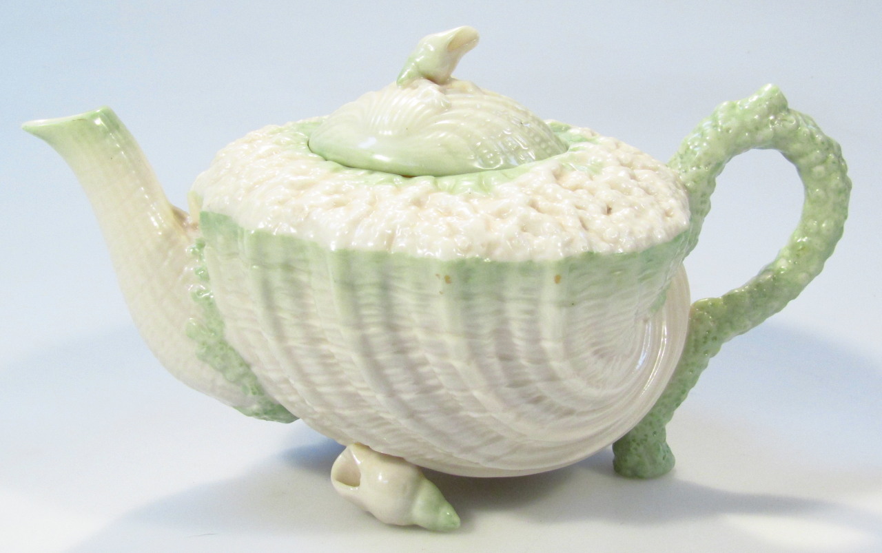 Appraisal: A Belleek Fine Parian china shell Neptune teapot with green