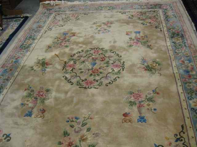 Appraisal: Chinese Sculptured Wool Rug room size vases with flowers tan