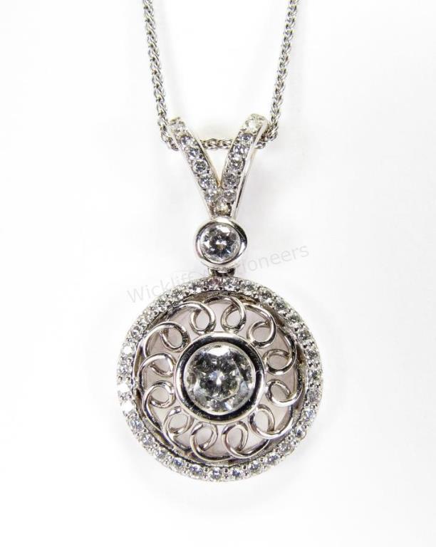 Appraisal: An K white gold round pendant with approximately ct round