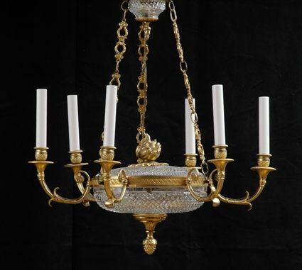 Appraisal: EMPIRE-STYLE GILT-METAL MOUNTED CUT-GLASS SIX-LIGHT CHANDELIER The diamond-faceted bowl with