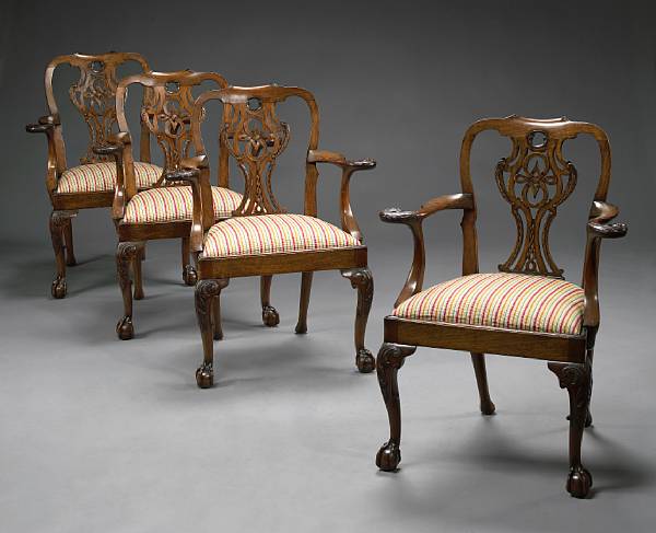 Appraisal: A set of four George III style carved mahogany armchairs