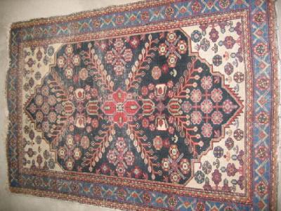 Appraisal: AN ANTIQUE NORTH WEST PERSIAN RUG the ivory floral field