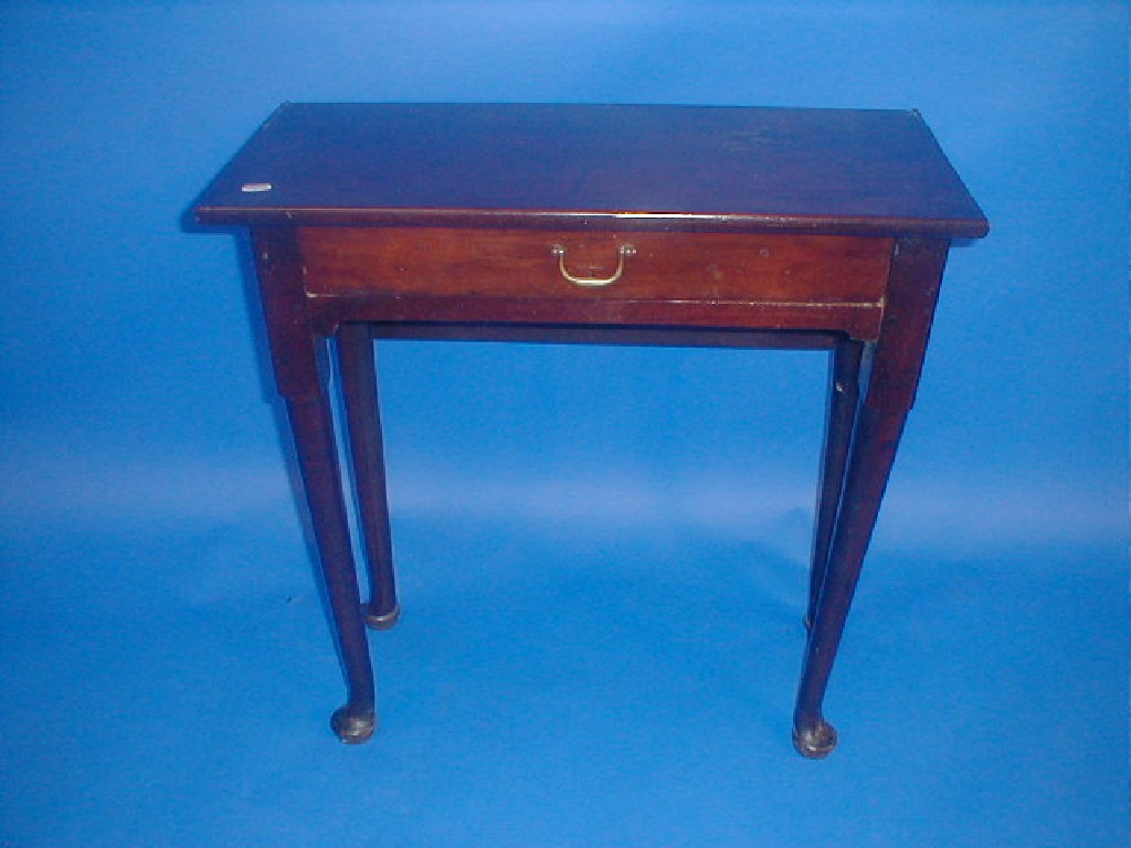 Appraisal: An thC mahogany tea table with fold-over top frieze drawer