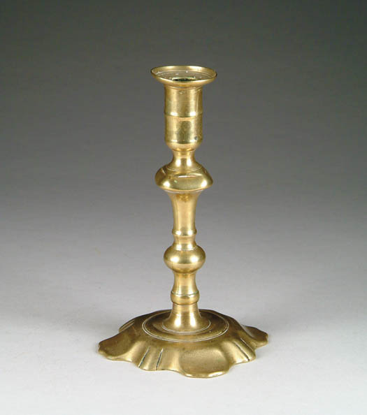 Appraisal: EARLY QUEEN ANNE BRASS CANDLESTICK Petal style base with turned