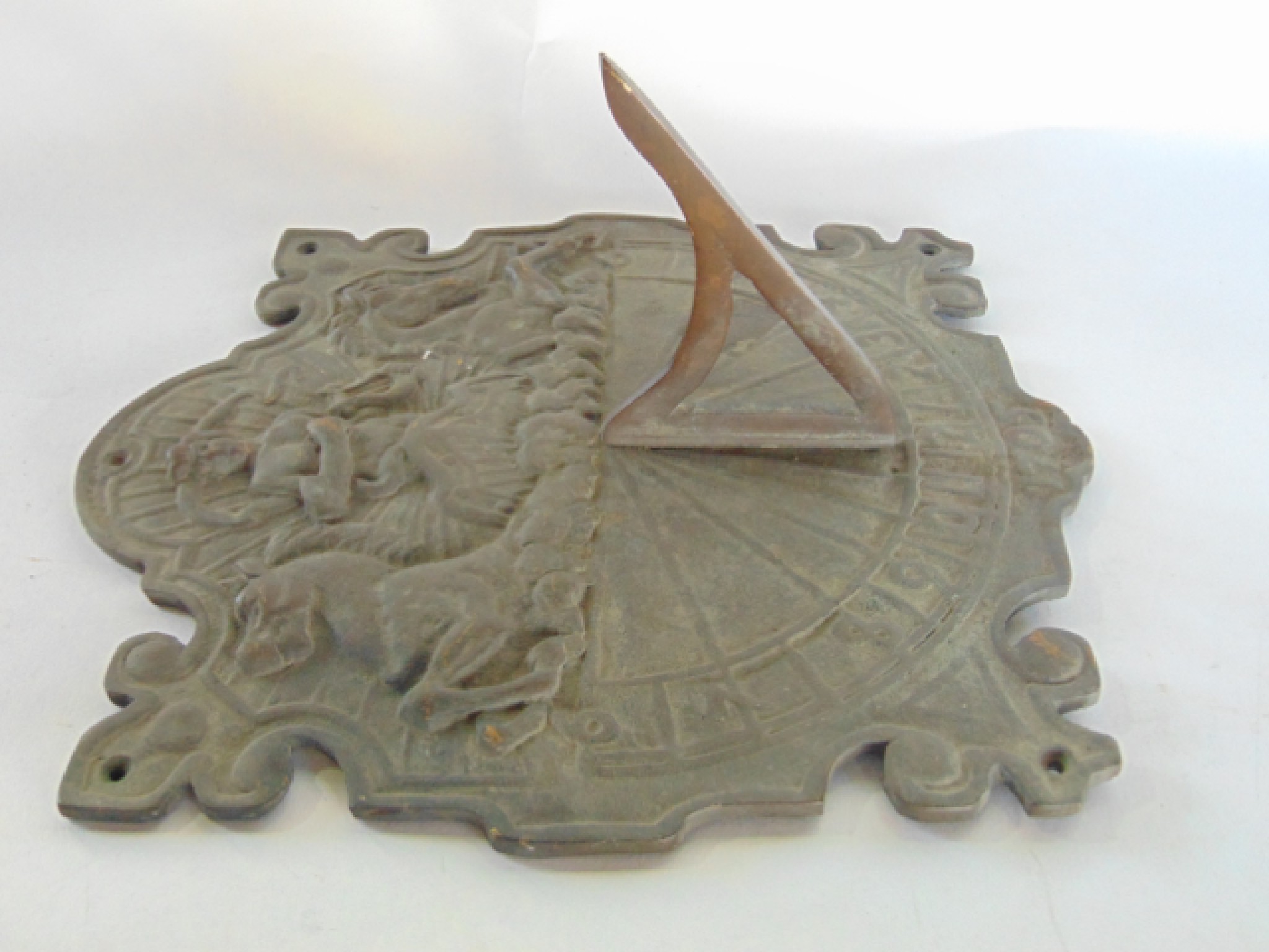 Appraisal: An old English style cast iron wall mounted sun dial