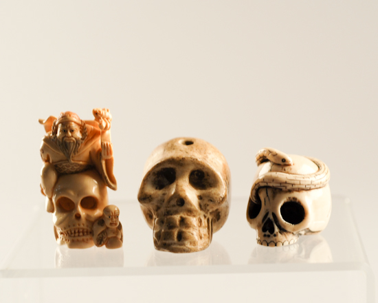 Appraisal: Three Skull Netsukes one of nephrite jade possibly Han Dynasty