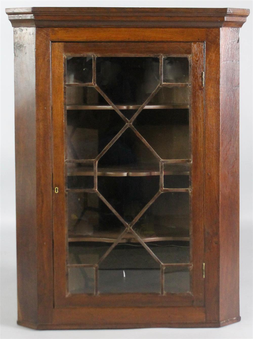 Appraisal: ENGLISH OAK HANGING CORNER CABINET having a molded cornice with