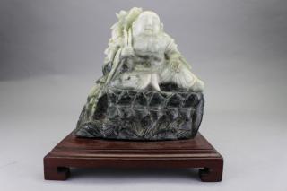 Appraisal: Chinese Carved Spinach Jade Seated Buddha on wooden stand Overall