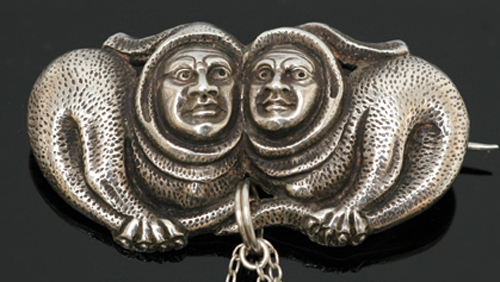 Appraisal: A silver brooch by Henrik Moller Depicting two mythical creatures