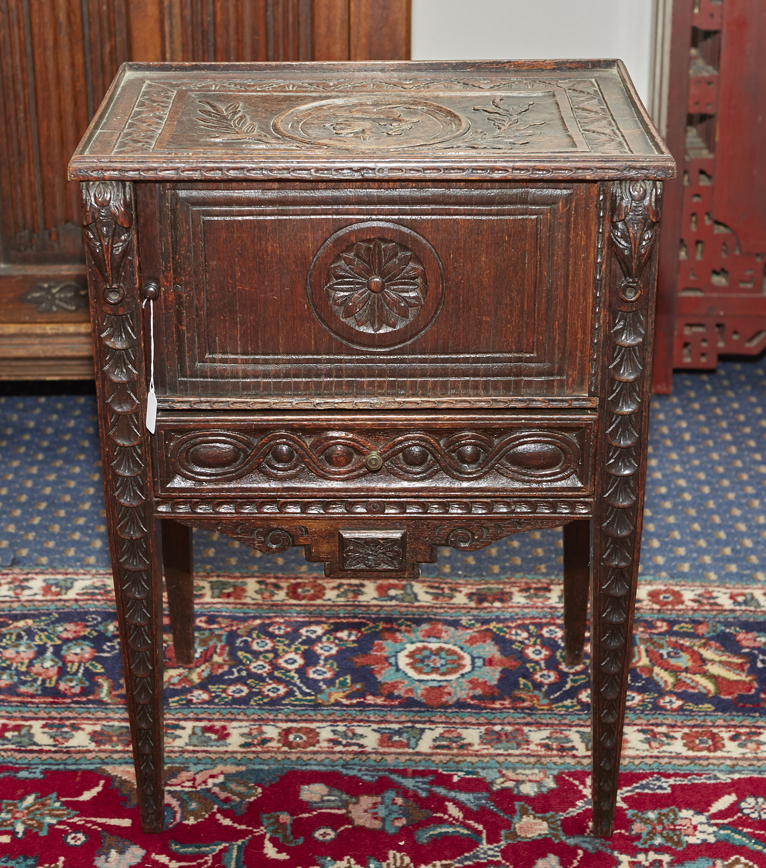 Appraisal: AN UNUSUAL ENGLISH OAK SIDE CABINET WITH 'ROMAYNE' PORTRAIT PANELLED