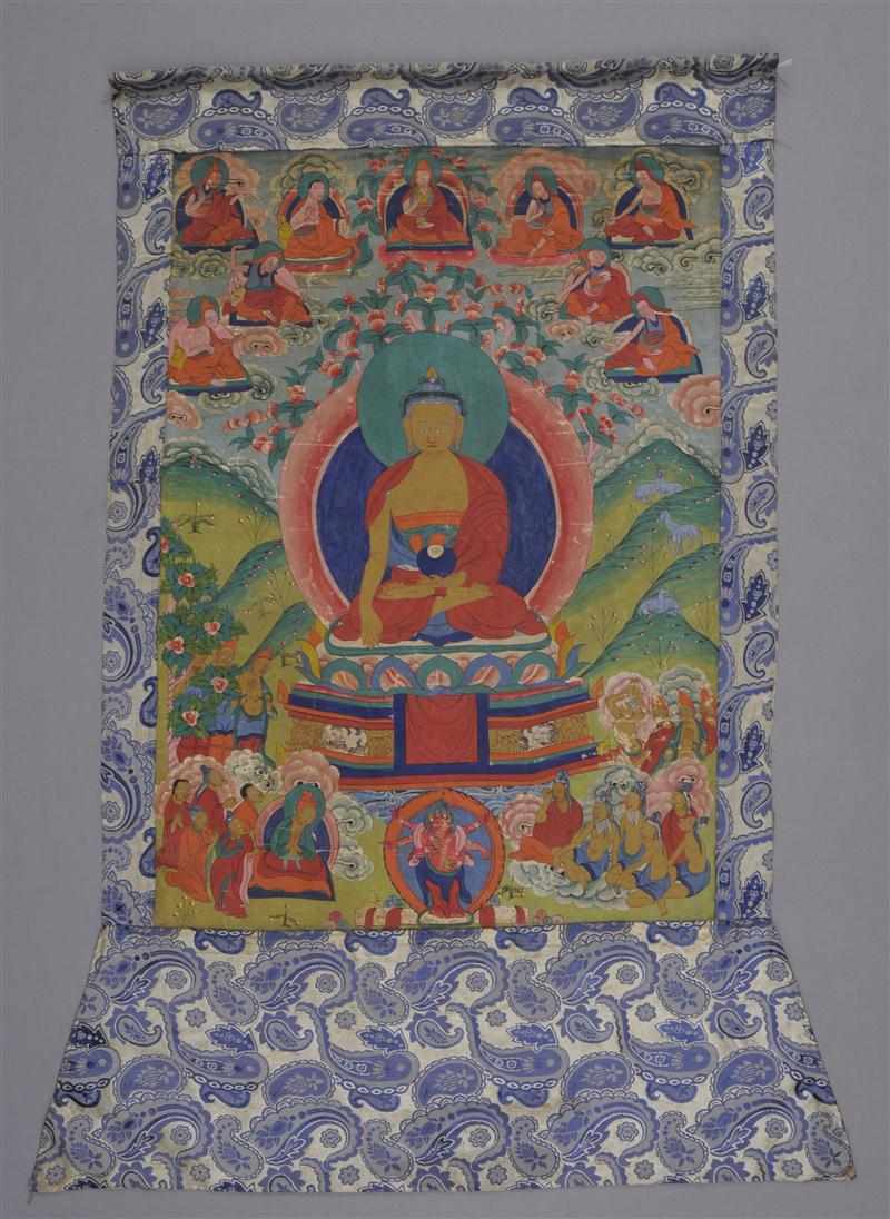 Appraisal: TIBETAN THANKA The central deity in lotus pose encircled by