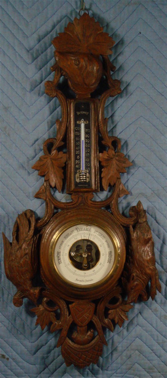 Appraisal: Carved walnut Black Forest aneroid barometer thermometer carved dog head