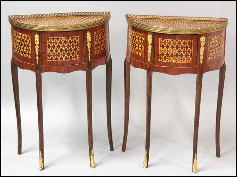 Appraisal: PAIR OF PARQUETRY INLAID DEMILUNE THREE-DRAWER TABLES Bearing ormolu mounts