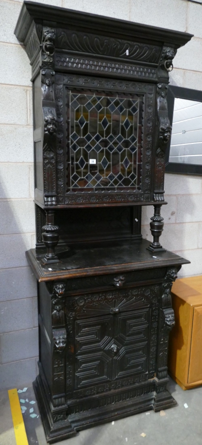 Appraisal: th Century carved dark oak cupboard with stained glass door