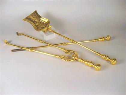 Appraisal: Group of three English brass fireplace tools th century Comprising