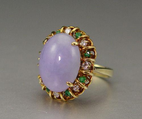 Appraisal: LAVENDER JADE EMERALD DIAMOND RING K yellow gold ring contains