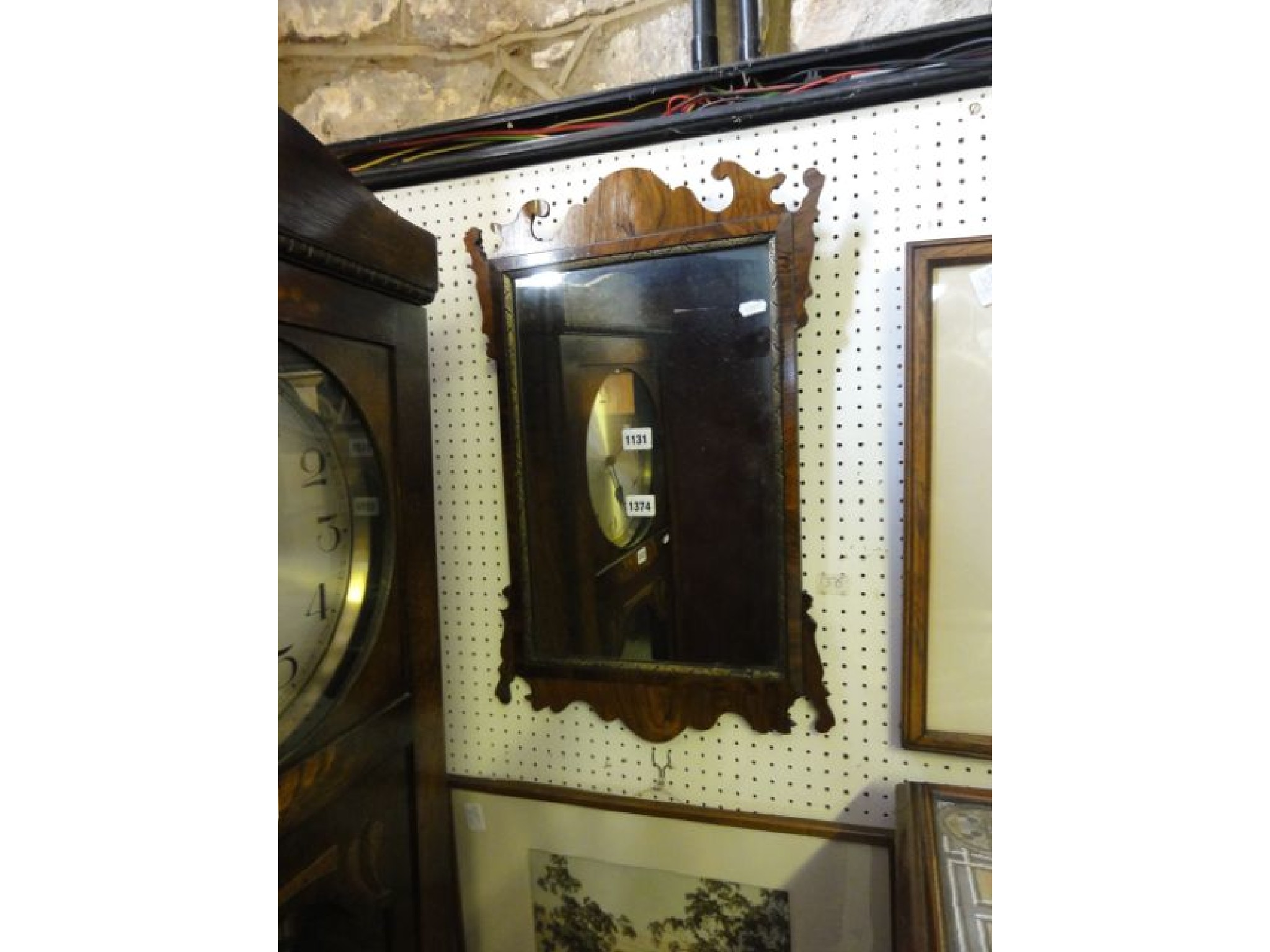 Appraisal: A Georgian style wall mirror the figured walnut frame with