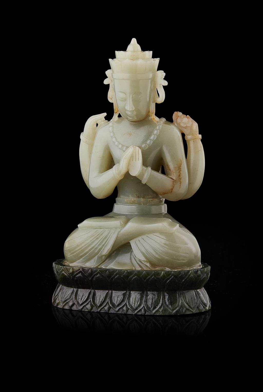 Appraisal: CELADON JADE FIGURE OF AVALOKITESVARA the four-armed figure carved seated