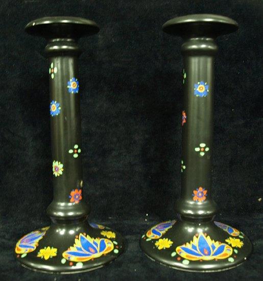 Appraisal: A pair of Crown Ducal candlesticks painted stylised designs and