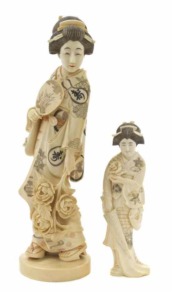 Appraisal: Two Japanese Ivory Figures depicting two standing women with loosely