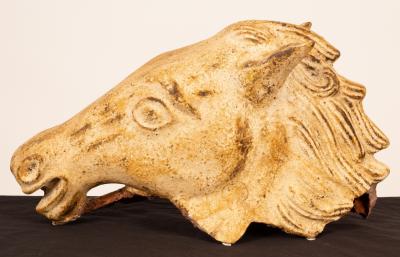 Appraisal: A contemporary painted terracotta sculpture of a horse head in