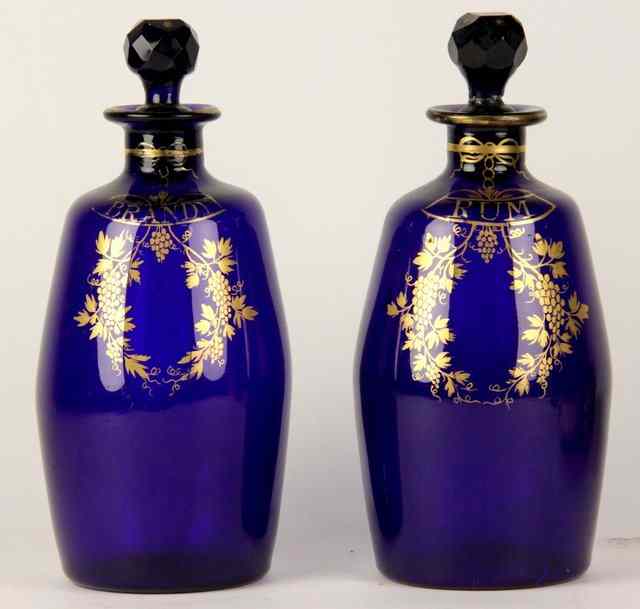 Appraisal: A pair of blue glass spirit decanters inscribed Brandy and