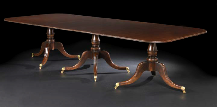 Appraisal: George III-Style Mahogany Dining Table the rounded rectangular top banded