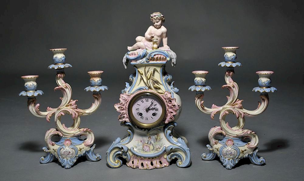 Appraisal: Sevres Clock French Sevres three piece clock set clock with