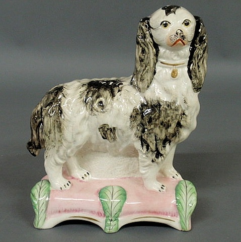 Appraisal: Rare black and white standing Spaniel on a pink base