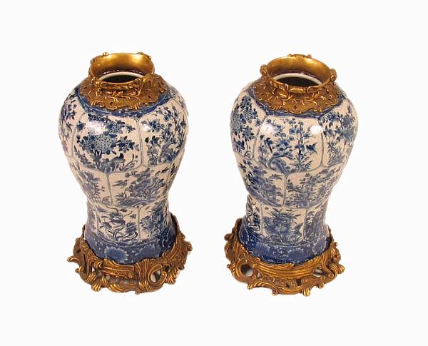 Appraisal: A pair of blue and white porcelain vases with bronze