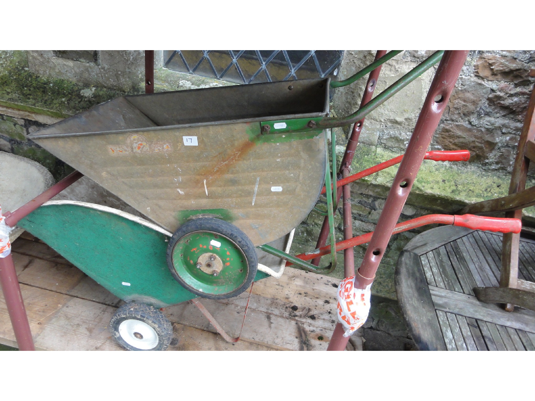 Appraisal: Three small garden wheel barrows of varying design two with