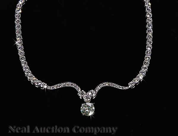 Appraisal: A Platinum and Diamond Necklace set with one round faceted