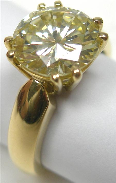 Appraisal: A modern ct gold mounted diamond single-stone ring claw set