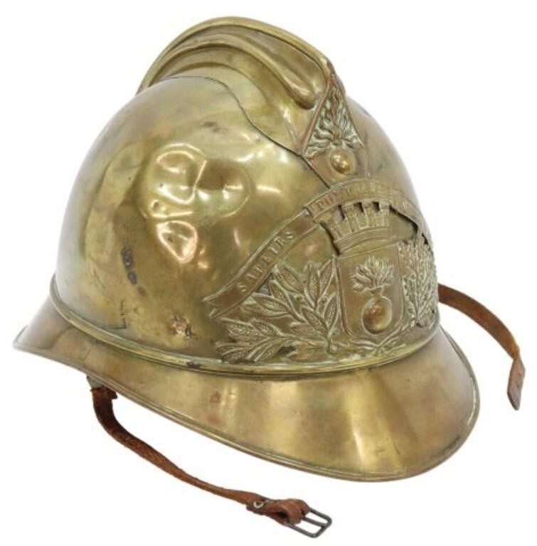 Appraisal: French brass fireman's helmet c the front emblem with banner