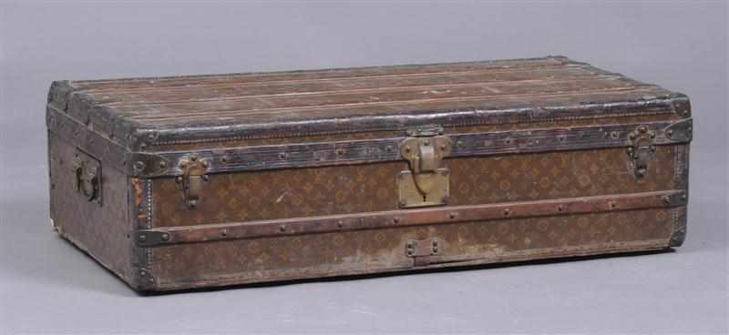 Appraisal: VINTAGE LOUIS VUITTON TRUNK With brass handles locks wood slatted