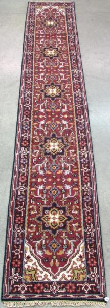 Appraisal: Handmade Oriental Runner Heriz design burgundy field with blue and