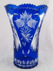 Appraisal: A large blue flashed cut glass vase with wheel engraved